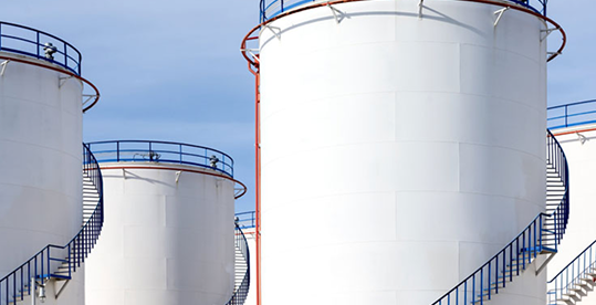 Large storage containers coated with protective industrial coatings