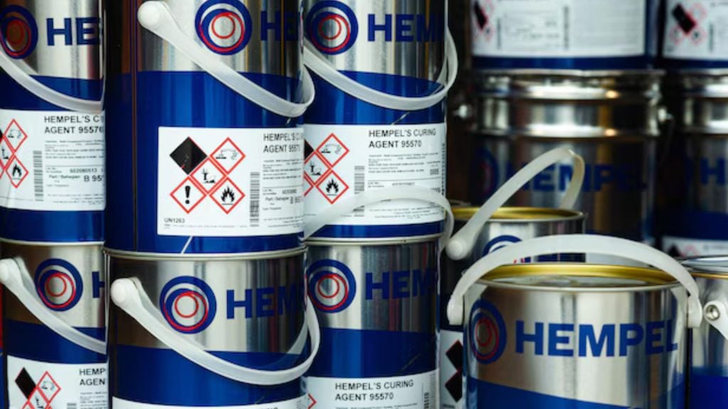 Stacked Hempel coating products in storag
